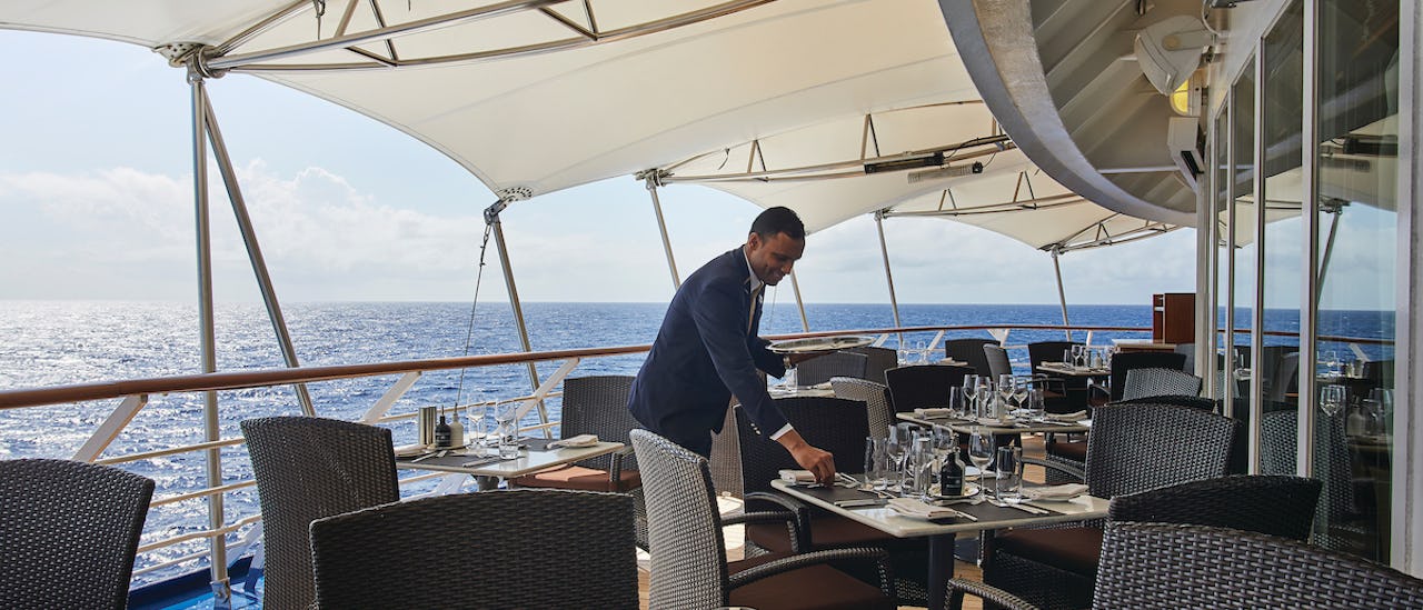 Outdoor dining with sea views.